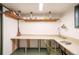 Finished basement featuring a work desk with laminate floor and shelves at 4467 W 30Th Ave, Denver, CO 80212