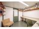 Finished basement features workbench with shelving, perfect for a home office or hobbies at 4467 W 30Th Ave, Denver, CO 80212