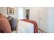 Comfortable bedroom featuring soft bedding, a side table, and a view into the closet at 4467 W 30Th Ave, Denver, CO 80212