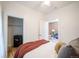 Inviting bedroom with a cozy closet, exposed brick, and a comfortable living room view at 4467 W 30Th Ave, Denver, CO 80212