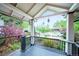 Inviting front porch with black railings and a view of the landscaped yard at 4467 W 30Th Ave, Denver, CO 80212