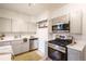This modern kitchen features stainless appliances and updated countertops at 4467 W 30Th Ave, Denver, CO 80212
