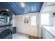 Well-lit laundry room with a new washer and dryer, and view at 4467 W 30Th Ave, Denver, CO 80212