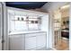 Laundry room featuring white cabinets and a kitchen view at 4467 W 30Th Ave, Denver, CO 80212