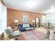 Cozy living room with exposed brick wall, hardwood floors, and modern furnishings at 4467 W 30Th Ave, Denver, CO 80212