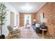 Sunlit living room with exposed brick wall, hardwood floors, and modern furnishings at 4467 W 30Th Ave, Denver, CO 80212