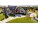 Luxury home with a large driveway and landscaping, seen from above at 6816 Goldbranch Dr, Niwot, CO 80503