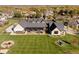 Aerial view of house, showing large backyard, hot tub and landscaping at 6816 Goldbranch Dr, Niwot, CO 80503