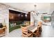 Basement dining area with green velvet banquette at 6816 Goldbranch Dr, Niwot, CO 80503