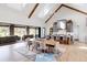 Open concept dining area with a large wooden table and access to a patio at 6816 Goldbranch Dr, Niwot, CO 80503
