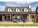Home exterior showcasing a pergola-covered patio and landscaped yard at 6816 Goldbranch Dr, Niwot, CO 80503