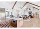 Bright kitchen features an island, stainless steel appliances, and hardwood floors at 6816 Goldbranch Dr, Niwot, CO 80503