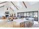 Open concept kitchen with island, stainless steel appliances, and hardwood floors at 6816 Goldbranch Dr, Niwot, CO 80503