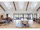 High-ceilinged living area with sliding doors opening to the backyard at 6816 Goldbranch Dr, Niwot, CO 80503