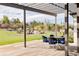 Covered patio with table and chairs, offering a relaxing outdoor space at 6816 Goldbranch Dr, Niwot, CO 80503