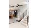 Basement stairs with glass and wood at 6816 Goldbranch Dr, Niwot, CO 80503
