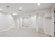 Finished basement with carpet flooring, recessed lighting, and potential for flexible use at 2285 Fulton St, Aurora, CO 80010