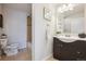 Updated bathroom with modern vanity, tile flooring, and separate toilet and shower area at 2285 Fulton St, Aurora, CO 80010