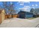 A detached two car garage with a large driveway, providing convenience and additional parking at 2285 Fulton St, Aurora, CO 80010