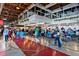 Bright marketplace space with dining, shopping, and community activities under industrial ceilings at 2285 Fulton St, Aurora, CO 80010
