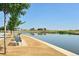 Scenic view of houses along a calm pond, offering serene beauty and recreational opportunities at 2285 Fulton St, Aurora, CO 80010