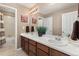 Double sink bathroom with an extra long vanity, decorative wall art and neutral colors at 6803 Esmeralda Dr, Castle Rock, CO 80108