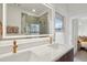 Elegant bathroom with double vanity and a large mirror at 1086 S Pearl St, Denver, CO 80209