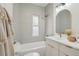 Modern bathroom with a bathtub, updated vanity, and stylish tile at 1086 S Pearl St, Denver, CO 80209