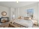 Spacious bedroom with a king-size bed and large window at 1086 S Pearl St, Denver, CO 80209