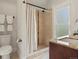 Well-appointed bathroom features a shower, toilet and granite countertop vanity at 1423 Elizabeth St, Denver, CO 80206
