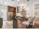 Kitchen with breakfast bar, stainless steel appliances, wood cabinets and white subway tile backsplash at 1423 Elizabeth St, Denver, CO 80206