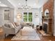 Cozy living room with hardwood floors, a decorative fireplace, and neutral decor, creating a relaxing atmosphere at 1423 Elizabeth St, Denver, CO 80206