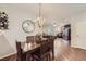 Bright dining area with hardwood floors and a chandelier at 8767 E Dry Creek Rd # 1312, Englewood, CO 80112