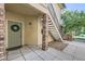 Townhome entrance with brick stairs and a green door at 8767 E Dry Creek Rd # 1312, Englewood, CO 80112