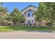 Two-story townhome with landscaped grounds and a brick facade at 8767 E Dry Creek Rd # 1312, Englewood, CO 80112