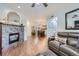 Open living room with hardwood floors and a fireplace at 8767 E Dry Creek Rd # 1312, Englewood, CO 80112