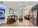 Spacious living room with hardwood floors and patio access at 8767 E Dry Creek Rd # 1312, Englewood, CO 80112