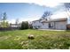 Spacious backyard with a large grassy area, perfect for outdoor activities and relaxation at 1838 Cedar St, Broomfield, CO 80020