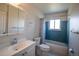 Bathroom featuring a tub, toilet, and a large mirror above the sink at 1838 Cedar St, Broomfield, CO 80020