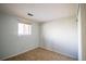 Standard bedroom featuring tile floor, a window, and closet space at 1838 Cedar St, Broomfield, CO 80020