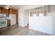 View of the kitchen leading into another room with wood floors at 1838 Cedar St, Broomfield, CO 80020