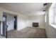 Bright living room featuring a fireplace and neutral carpet at 1838 Cedar St, Broomfield, CO 80020