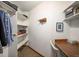 Walk-in closet with built-in shelves and clothing racks; and a small desk area at 17940 Smugglers Rd, Monument, CO 80132