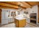Bright kitchen with stainless steel appliances, center island and ample counter space at 17940 Smugglers Rd, Monument, CO 80132
