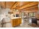 Spacious kitchen with white cabinets, stainless steel appliances and a kitchen island at 17940 Smugglers Rd, Monument, CO 80132