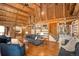 Spacious living room with high vaulted ceilings, fireplace, and custom shelving at 17940 Smugglers Rd, Monument, CO 80132