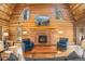 Cozy living room features vaulted ceilings, brick fireplace, and comfortable seating at 17940 Smugglers Rd, Monument, CO 80132