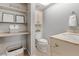 Cozy bathroom with open shelving and a vanity, decorated with decorative items at 8678 Mariposa St, Thornton, CO 80260