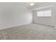 Bright bedroom with neutral carpet, ceiling fan, and window with blinds at 8678 Mariposa St, Thornton, CO 80260