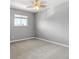 Cozy bedroom with neutral walls, carpet, ceiling fan, and a bright window at 8678 Mariposa St, Thornton, CO 80260
